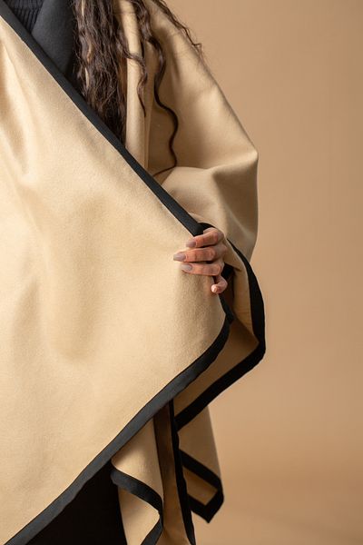 outline Camel shawl with black braids