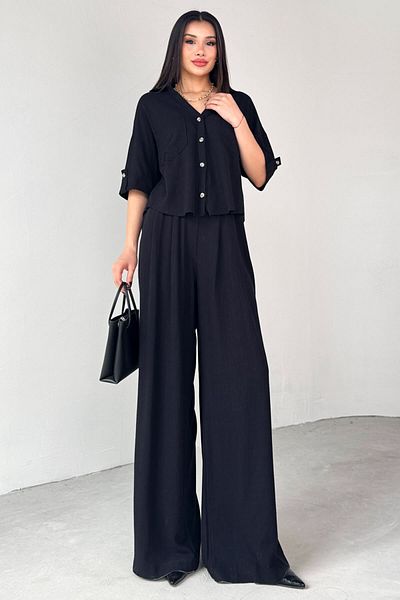 Cappmoda TKM-13303 طقم قميص أسود بأكمام قصيرة وجيب وبنطلون فضفاض مرن مكون من قطعتين