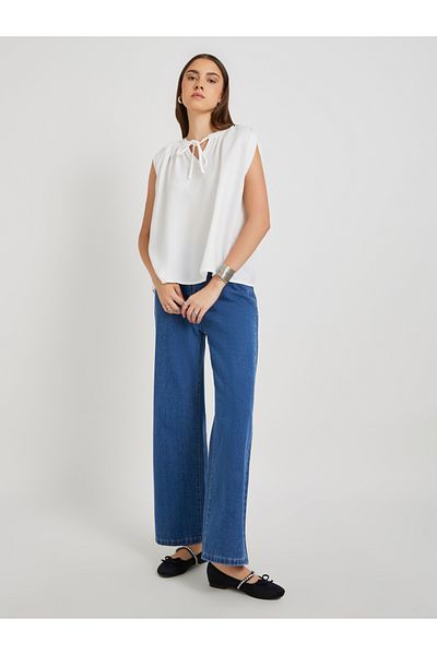 Styli Solid Sleeveless Tie-Up Neck Blouse