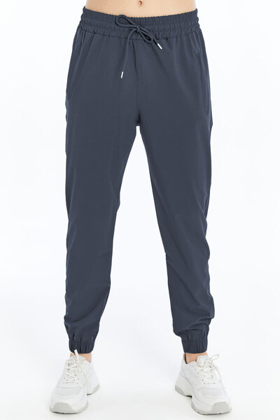 OXVİN Kadın Paçası Lastikli, Gizli Fermuar Cepli, Jogger Eşofman Paraşüt Kumaş Pantolon (BOL KALIP)