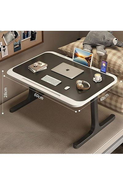 Un Versatile laptop table with a modern and lightweight design suitable for bed, office, and study