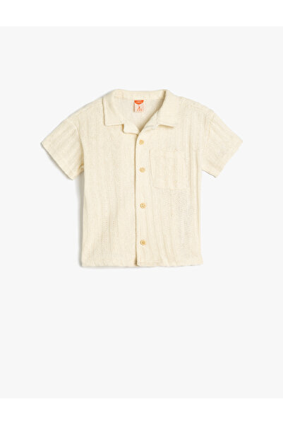 Koton تي شيرت قطني بأكمام قصيرة وجيب واحد أساسي برقبة بولو كبيرة الحجم