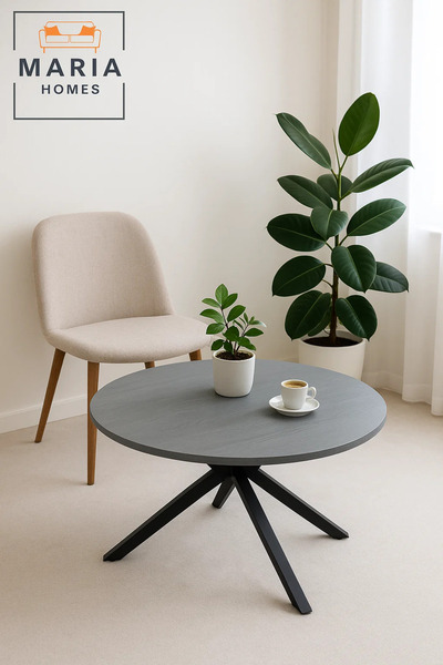 MARIA HOMES Grey stone round coffee table with angled black metal legs