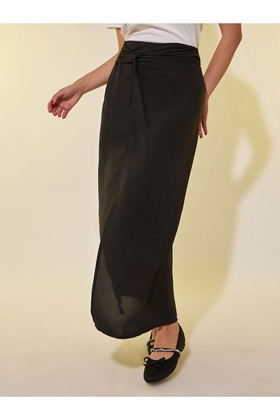 Styli Solid Asymmetric Hem Maxi Skirt with Twist Detail
