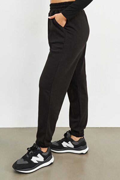 Curly Pantaloni de sport negri cu buzunar pentru geanta