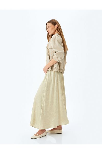 Koton Relax fit high-rise textured long satin flared skirt.