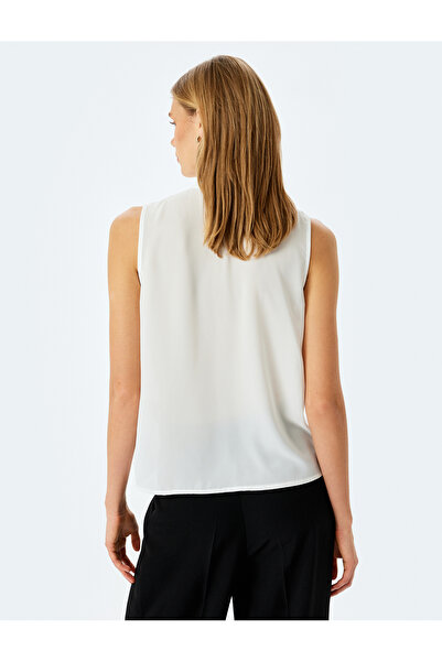 Koton Crepe fabric scarf collar ruffle sleeveless shirt.