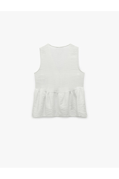 Koton X Melis Ağazat - Αμάνικη μπλούζα Peplum με λεπτομέρεια αξεσουάρ με κοχύλι