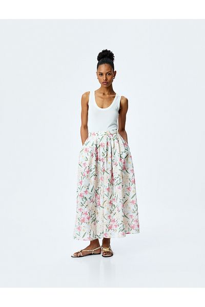 Koton Slit detail pocket detail high rise maxi flare floral skirt.