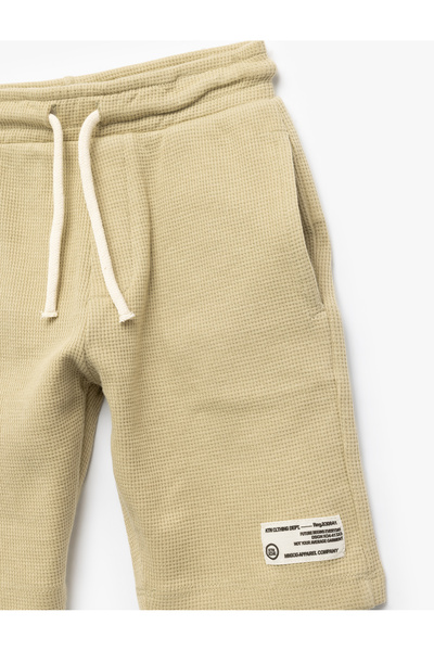 Koton Pamuklu Beli Bağlamalı Aplike Detaylı Cepli Şort