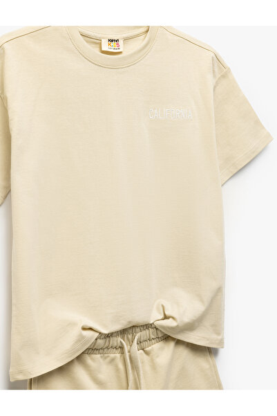 Koton Pamut Crew nyakú, rövid ujjú, hímzett felső, fűzős derékrész rövidnadrággal, kétrészes szett