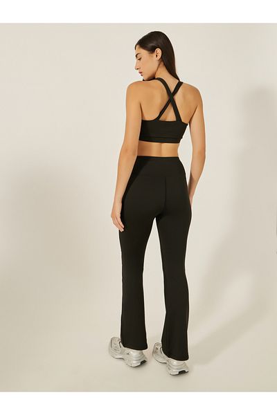Styli Pack of 3 - Multi Cross Back Padded Sports Bra, Panelled Top and Flared Leggings