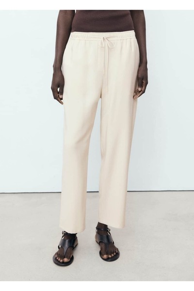 MANGO Woman Bağcıklı dökümlü pantolon