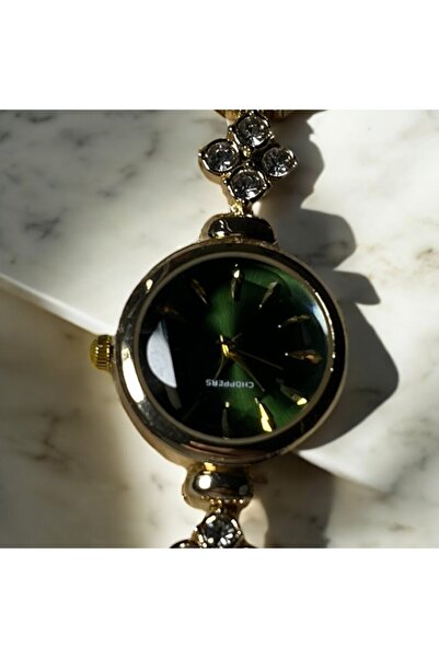 Çelik Yonca detay altın kordon saat