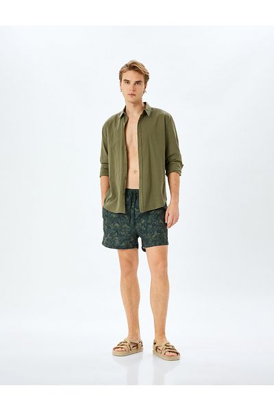 Koton Übergroße, mit Tarnmuster bedruckte Badeshorts mit Taschendetail