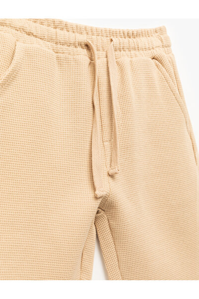Koton Pamuklu Dokulu Cep Detaylı Beli Bağcıklı Şort