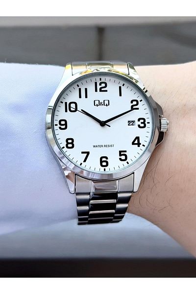 Q&Q Men's Silver Phosphorus Numeral Black Dial Date Analog Watch