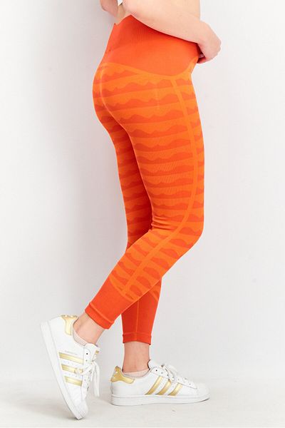 adidas بنطال ضيق نسائي من Adidas x Marimekko Aerokit 7/8، برتقالي
