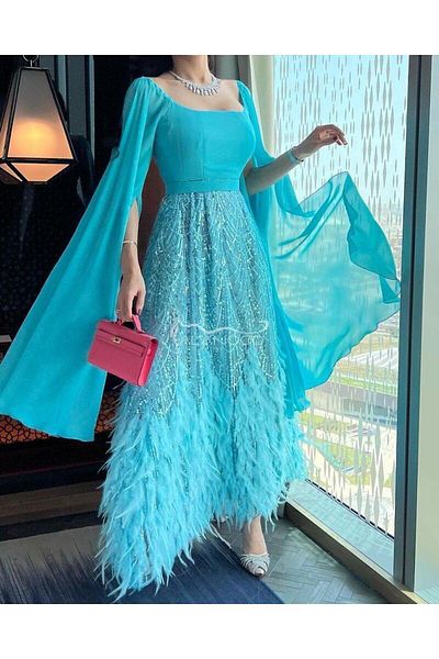 ALANOOD FASHION Sky blue chiffon and feather evening dress - Discover the splendor of elegance with Al Anoud Al Anzi