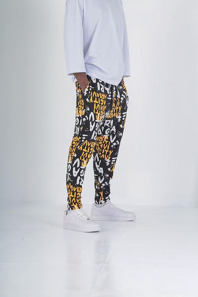 COCOPELLI Yellow Graffiti Patterned Baguette Trousers