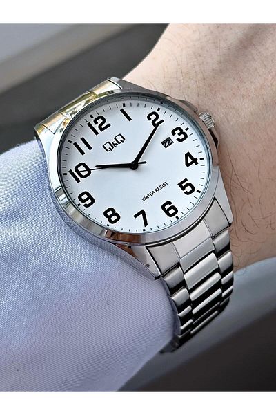 Q&Q Men's Silver Phosphorus Numeral Black Dial Date Analog Watch