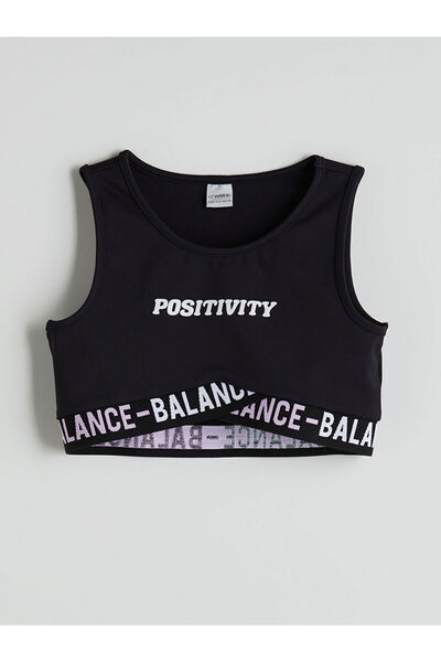 LC Waikiki صدرية للفتيات مطبوعة برقبة دائرية باللون الأسود