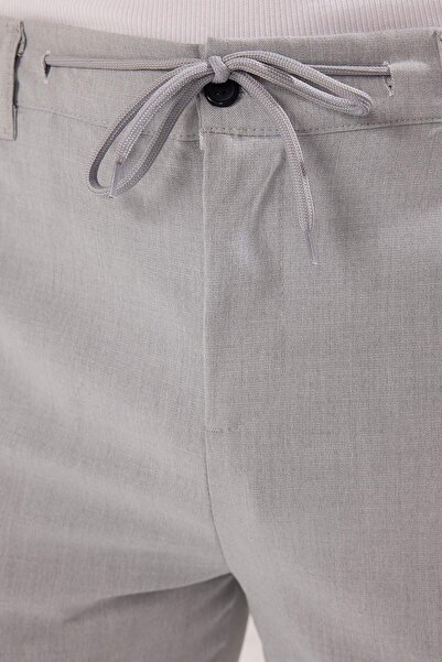 Trendyol Collection Hellgraue Slim-Fit-Hose mit elastischem Stoff und gewebter Taille mit Schnürdetail TMNAW25PL00027