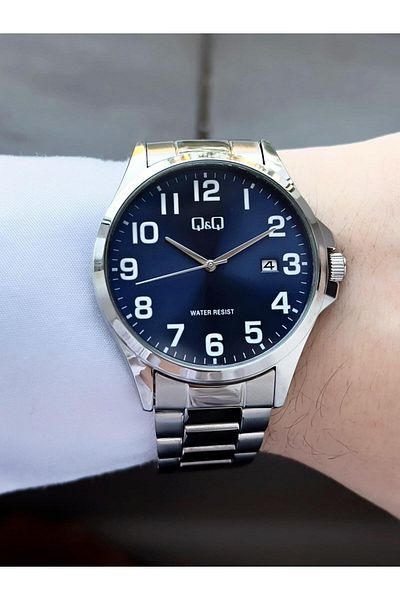 Q&Q Men's Silver Phosphorus Numeral Black Dial Date Analog Watch