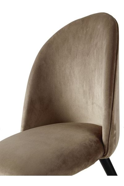 rexa velvet chair with a curved back and black legs