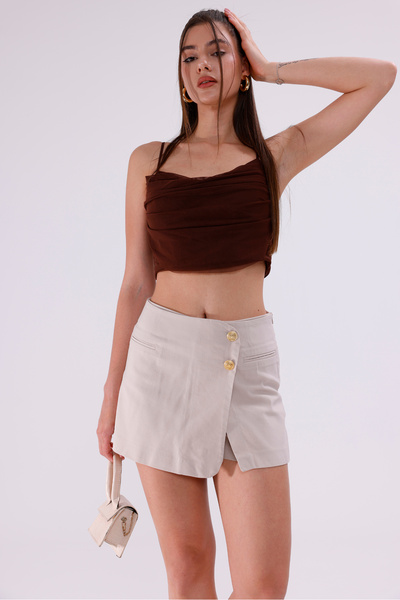 LA PANTE Κρεμ σορτς με λεπτομέρεια με κουμπί στο μπροστινό μέρος