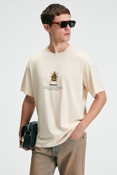 GRIMELANGE Bold men's 100% cotton Oversized fit Printed short sleeve round neck vanilla t-shirt