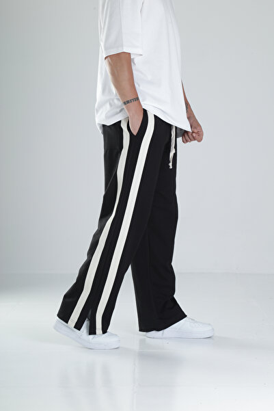 COCOPELLI Fekete tréningruha csíkos hasítékkal