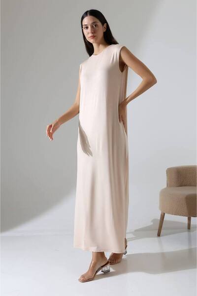 MetuCA قميص نسائي بيج كبير الحجم بدون أكمام وياقة دائرية أساسي يومي طويل من ق...