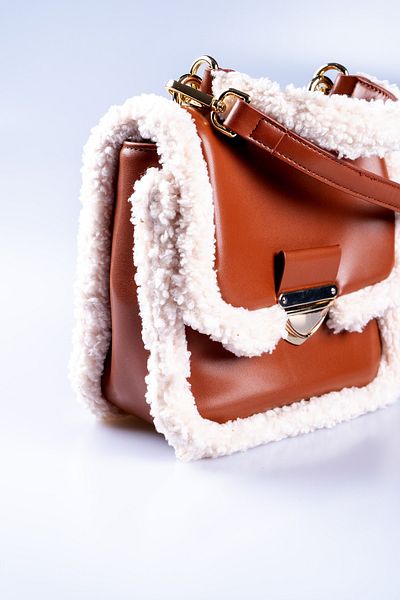 Oblavion Adjustable Hand and Shoulder Bag with Plush Detailed Tan Vegan Leather Cover