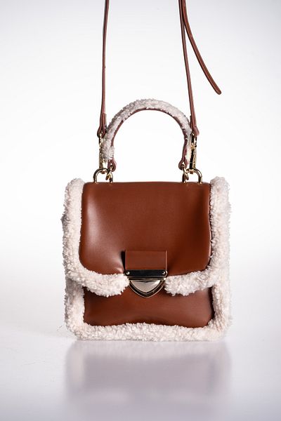 Oblavion Adjustable Hand and Shoulder Bag with Plush Detailed Tan Vegan Leather Cover