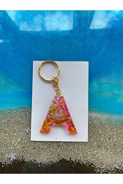 Yopoksi Desing سلسلة مفاتيح من الإيبوكسي على شكل حرف A باللون الوردي مع ورق ذ...