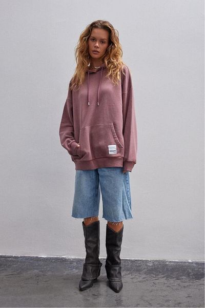 bases. Oversized Hooded Sweatshirt with Faded Effect and Fleece Inside