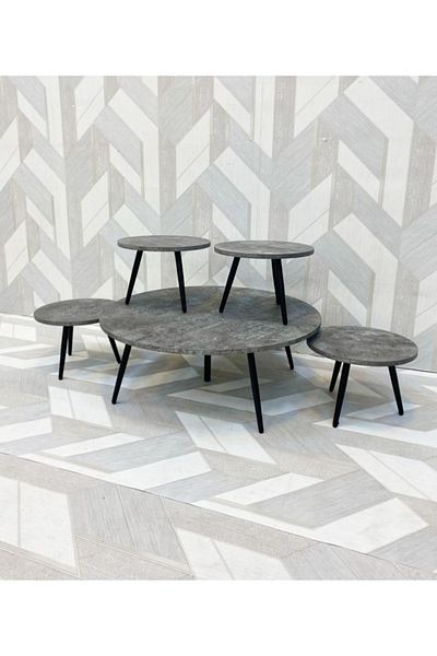 DEC13 A set of round floor tables in three elegant and distinctive colors