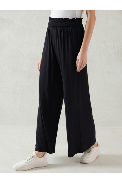 Femmella By Styli Black Smocked Waistband Flared Knit Pants