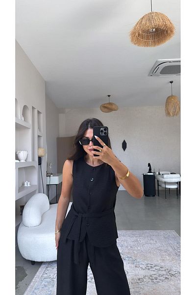 Buket Teke بدلة سترة سوداء بأزرار