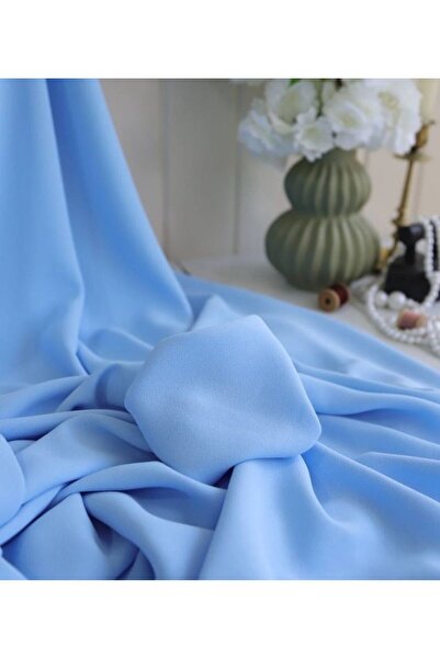 Parça Kumaş Dünyası Kumlu Krep Bebe Mavi Renkte Dökümlü Kumaş