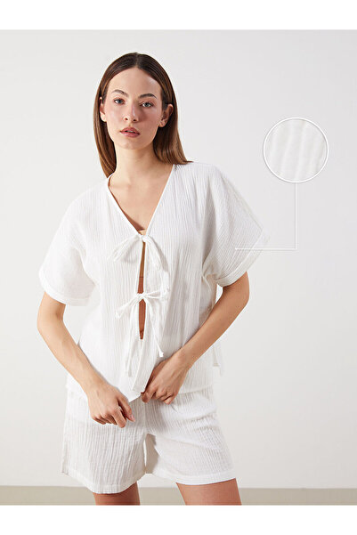 LC Waikiki Özmarka New Season V-Neck Textured Muslin Blouse with Bow on the F...