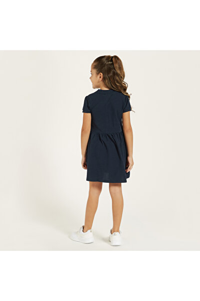 Juniors Solid Polo Dress With Short Sleeves And Button Closure