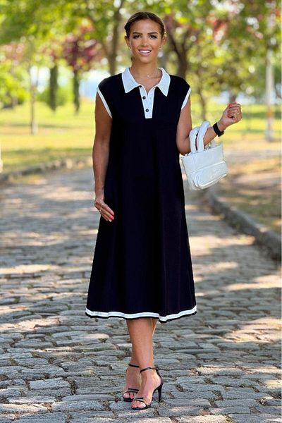 Nevin Kaya Moda Λευκό φόρεμα με μαύρες αμάνικες φούστες και γιακά