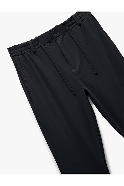 Koton Katlamalı Paça Beli Bağcıklı Non Iron Düğmeli Esnek Slim Fit Pantolon