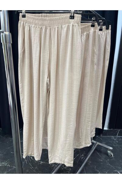 Butik belilastiklii havuç pantolon krem