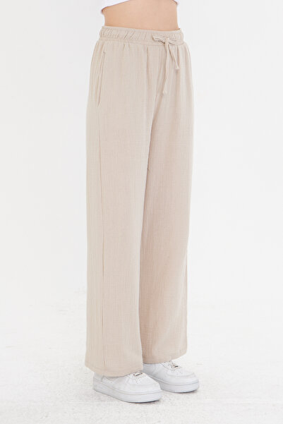 THIFF GYMWEAR بنطلون نسائي من الموسلين باللون البيج واسع الساق