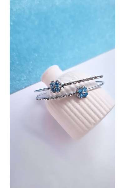 Serenity سوار من الفولاذ على شكل زهرة من حجر الزركون الأزرق