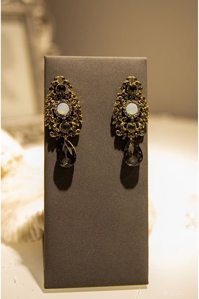 CHARM Gold statement earrings with white opal and black crystals