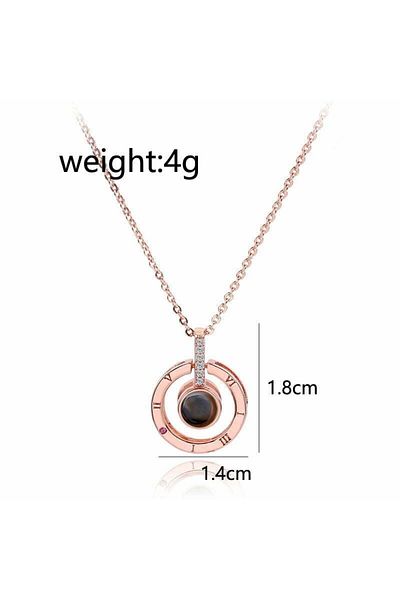 MBrands pendant necklace that projects the word "I Love You" in 100 languages